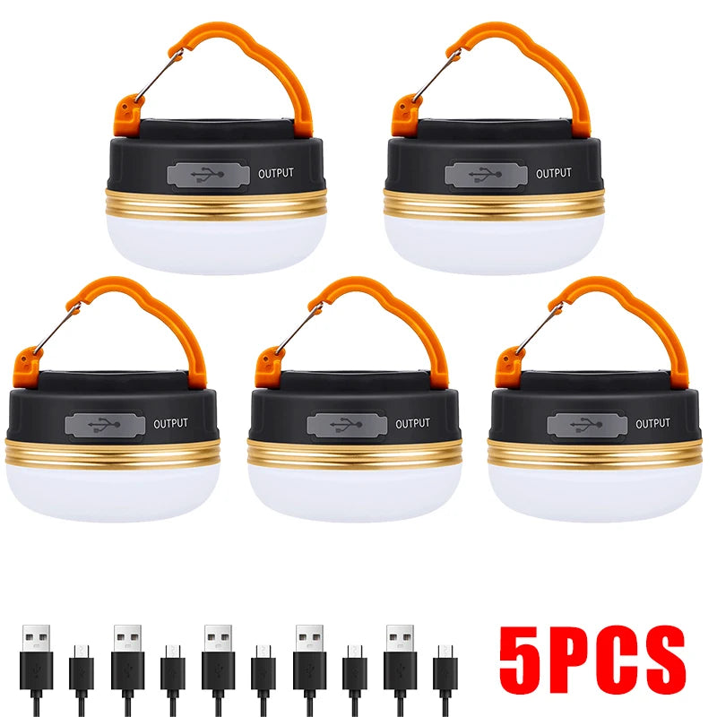Set of five camping lanterns with USB charging cables on a white background