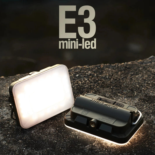 Two E3 mini-led lights on a dark surface with 'E3' branding.