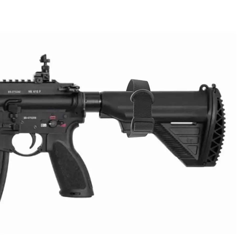 Black rifle with attached scope on a white background