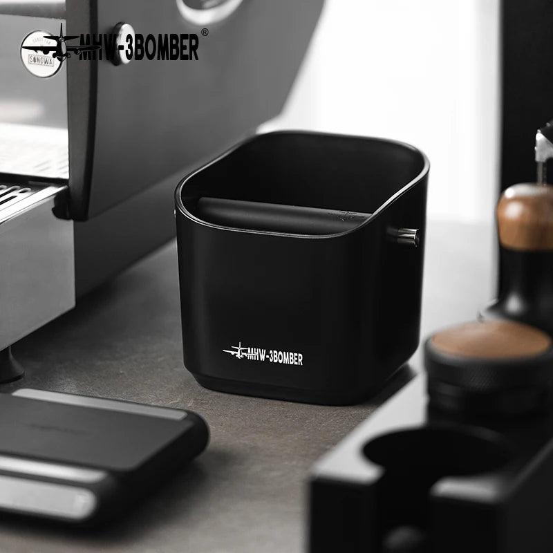 Black container with 'MHV-3BOMBER' logo on a kitchen counter