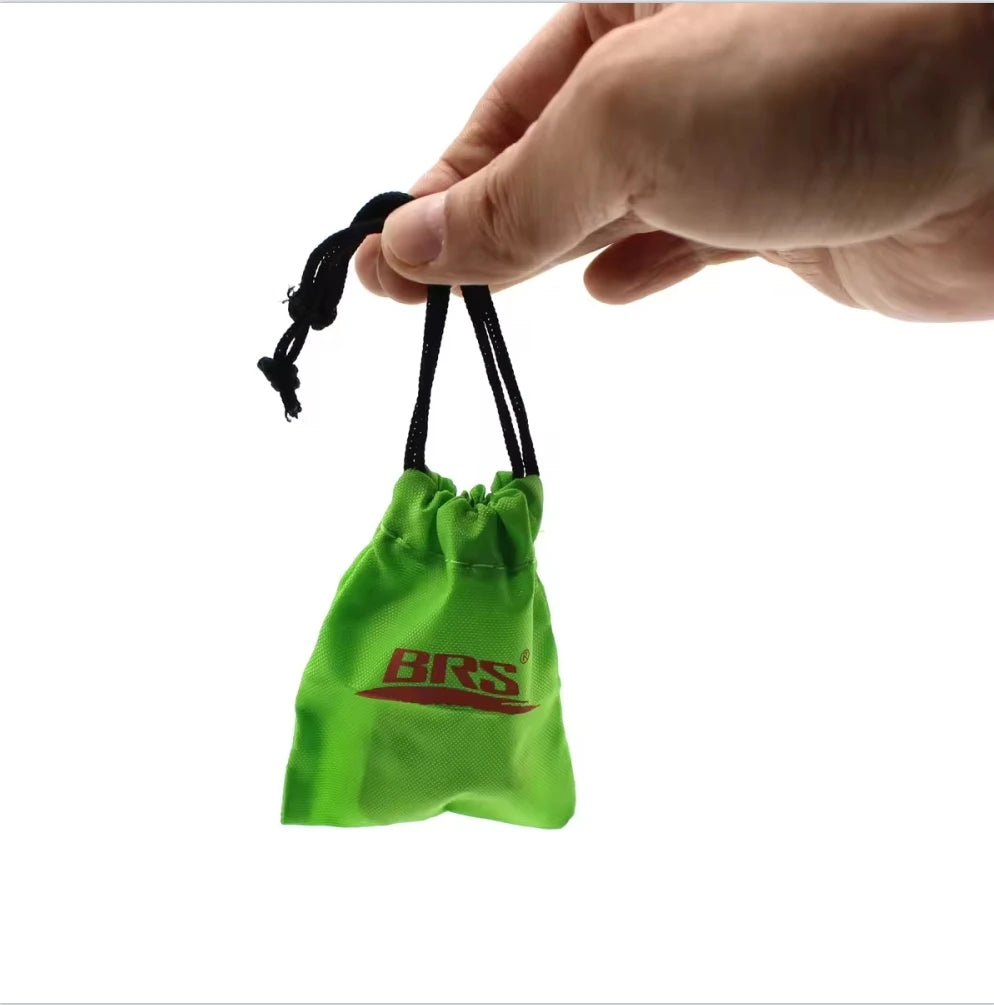 Green drawstring bag with 'BRS' logo held by a hand on a white background