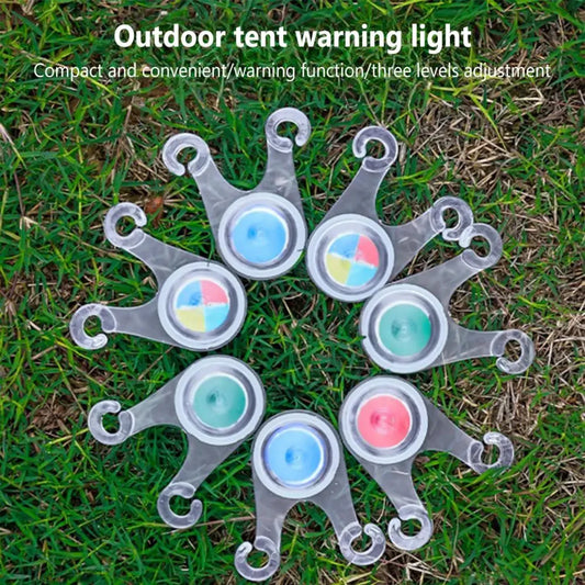 Outdoor tent warning light on grass with text indicating its function.