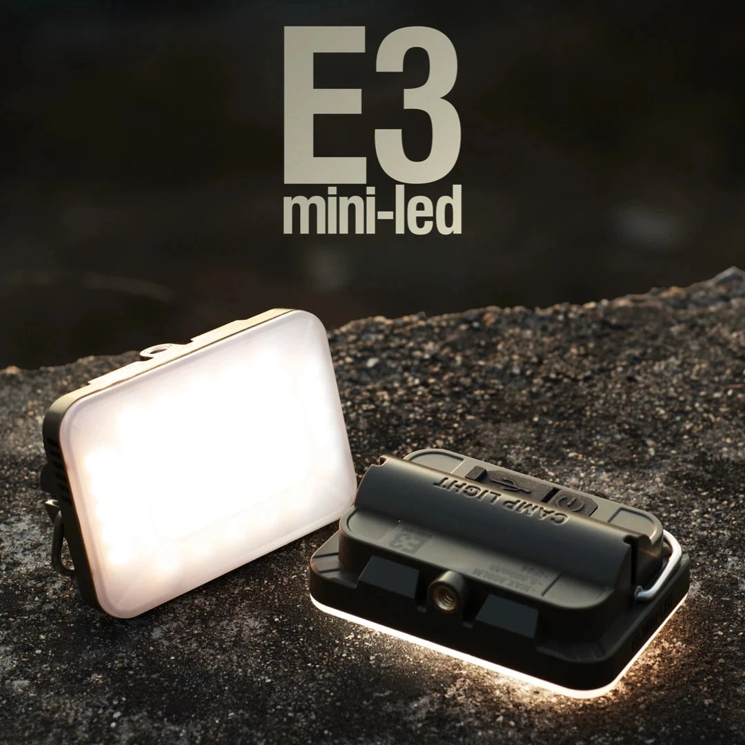 Two E3 mini-led lights on a dark surface with 'E3' branding.