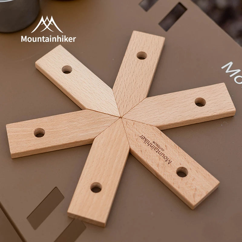 Wooden tool with 'Mountainhiker' branding on a brown surface