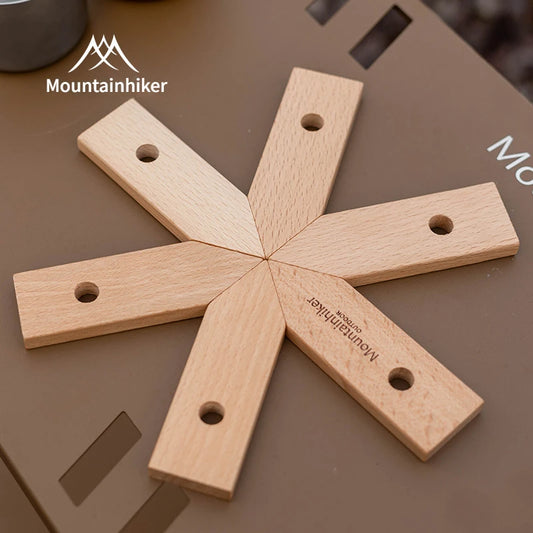 Wooden tool with 'Mountainhiker' branding on a brown surface
