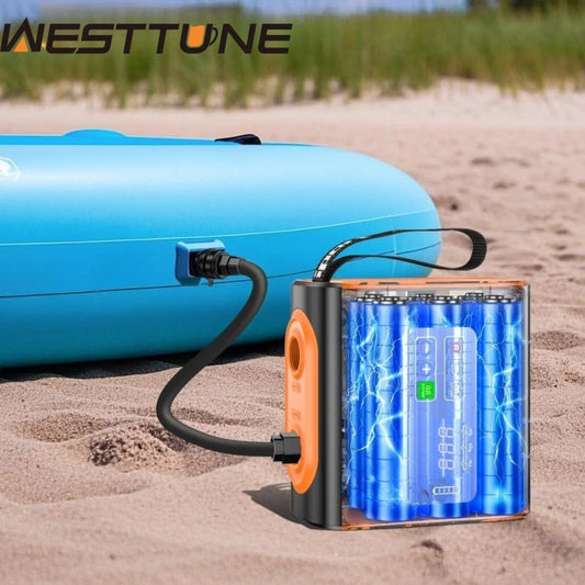 Blue inflatable boat with a Westtune air pump on a sandy beach