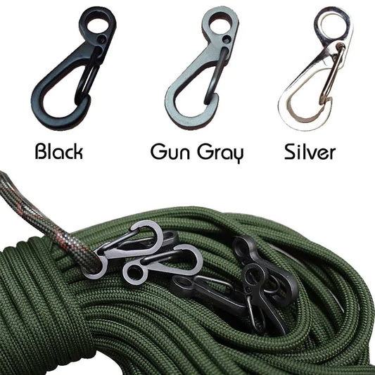 Three carabiners in black, gun gray, and silver with a green rope.