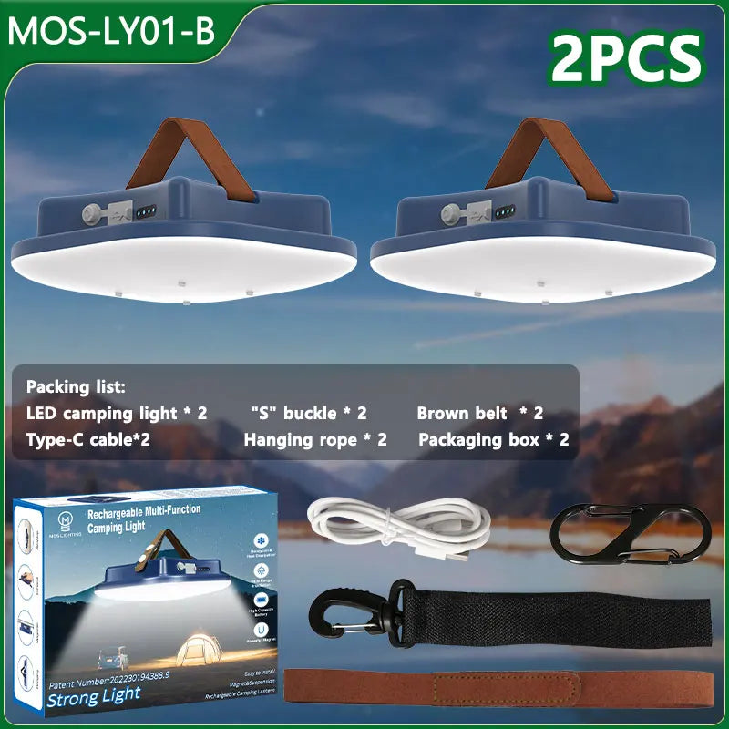 Two LED camping lights with accessories on a scenic background