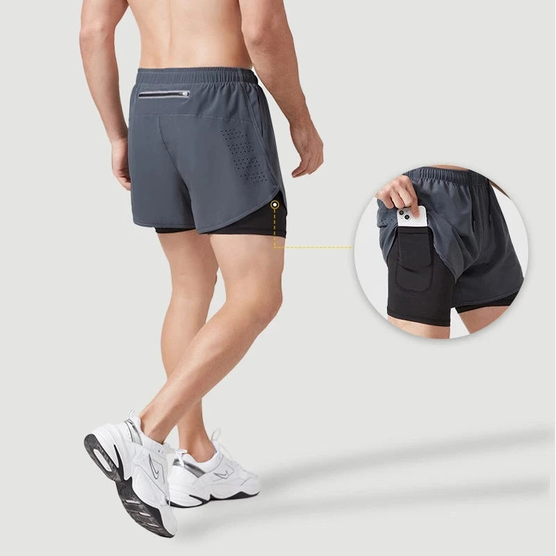 Person wearing gray athletic shorts with a close-up inset showing a pocket.