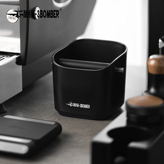Black container with 'MHV-3BOMBER' logo on a kitchen counter