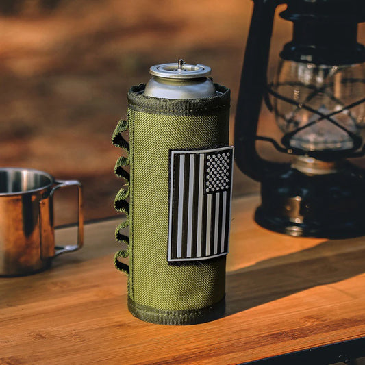Green can cooler with American flag patch on a wooden surface