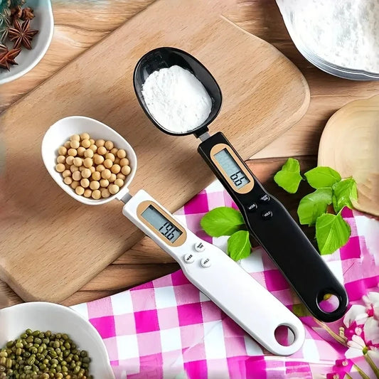 Digital measuring spoon with digital display on a kitchen counter with ingredients