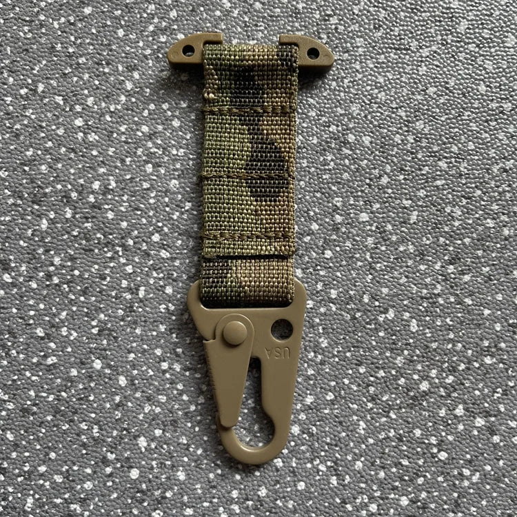 Camouflage strap with clip on a gray textured background