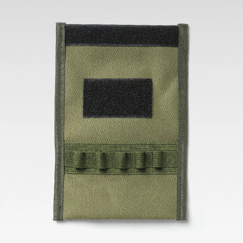 Green tactical patch with a black square and fringes on a white background