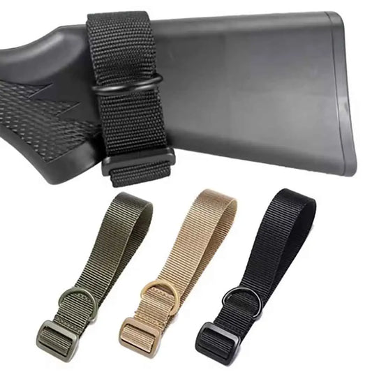 Black rifle stock with adjustable black, green, beige, and black straps on a white background