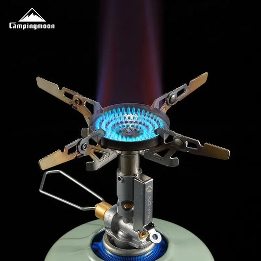 Camping stove with blue flame on a black background, featuring the Campingmoon brand.
