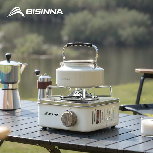 Bisinna camping stove with kettle on a table outdoors